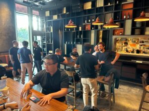 Blog Post: FV Bank and Shift Market's Morning Breakfast: A Token2049 Week Wrap-Up People in a restaurant networking and enjoying breakfast