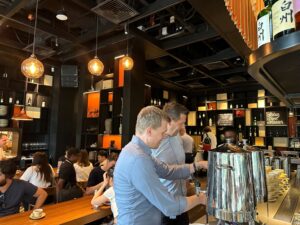 Blog Post: FV Bank and Shift Market's Morning Breakfast: A Token2049 Week Wrap-Up People in a restaurant networking and enjoying breakfast