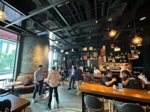 Blog Post: FV Bank and Shift Market's Morning Breakfast: A Token2049 Week Wrap-Up People in a restaurant networking and enjoying breakfast